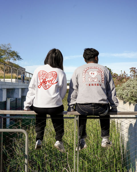 back view of the Do Everything in Love Christian faith crewnecks in white and grey. Made in the USA.